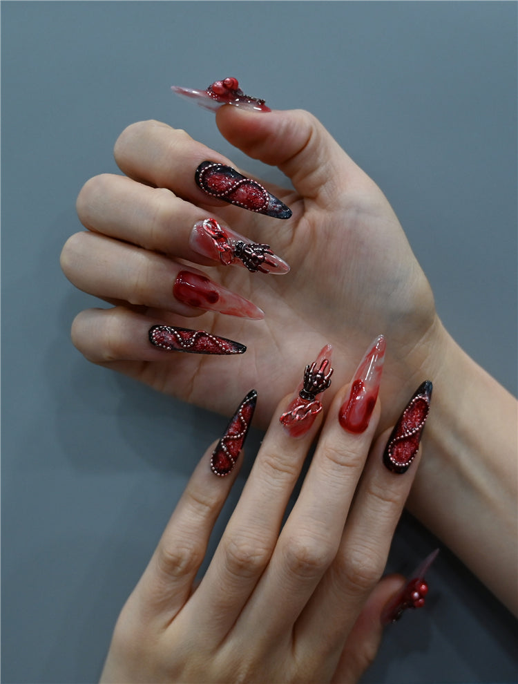 Long stiletto handmade nails with 3D rose, chain, and skull accents