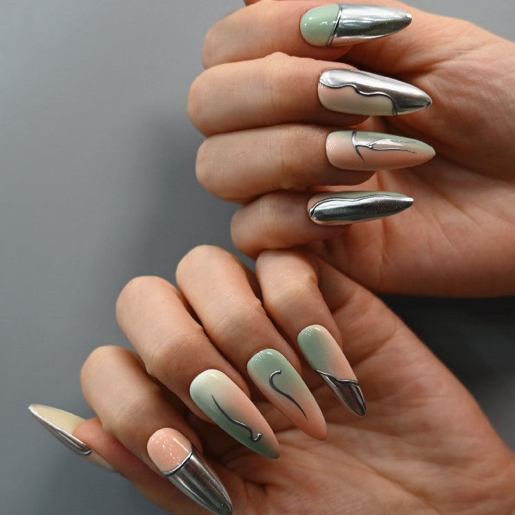 Elegant almond press-on nails in green, nude, and metallic silver mix