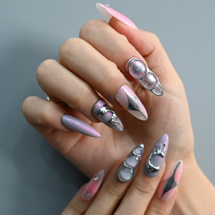 Handmade stiletto nails with cosmic orb bubbles and geometric silver designs