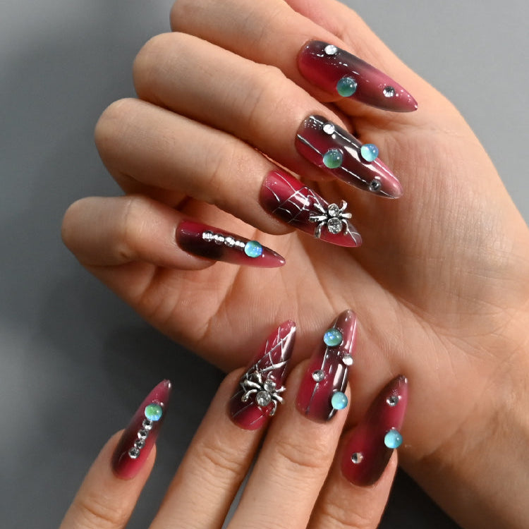 Gothic press-on nails with crystal rhinestones and creepy spider charms