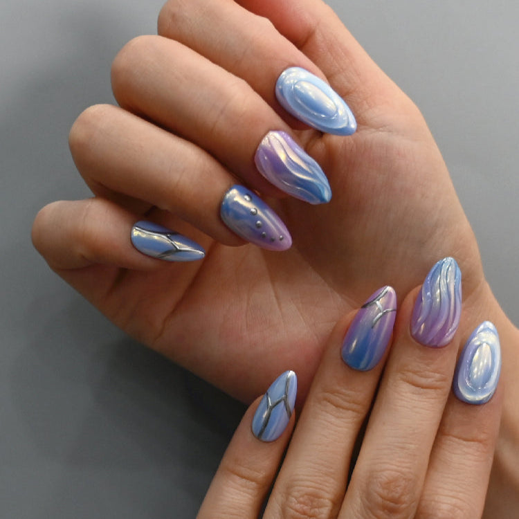 Handmade 3D almond nails with abstract silver lines and chrome accents