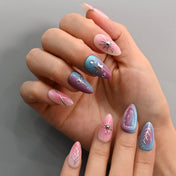 Playful ombre nails with pink blue fade and metallic accents