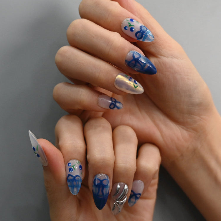 Fresh summer press-on nails with blue plaid, white base, silver metallic art, and berry motifs