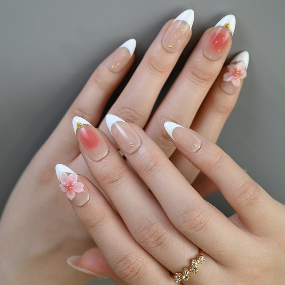 Elegant bridal nails with soft pink gradient, white tips, and delicate flower