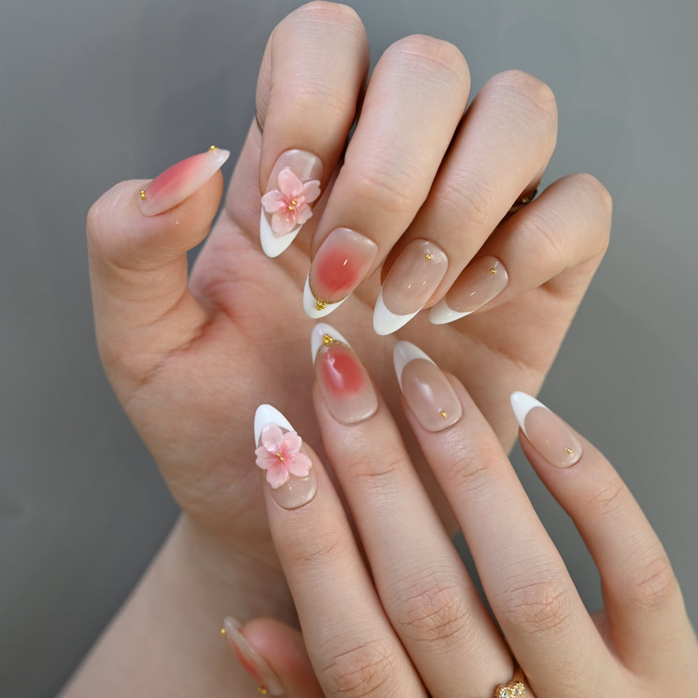 Handmade blush pink ombre nails with white tips and gold bead details
