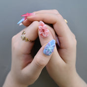 Summer press-on nails with tropical flower patterns and glossy finish