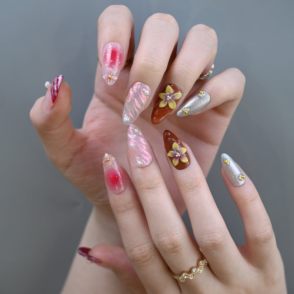 Elegant mixed design nails with ombre, shimmer, and 3D flowers