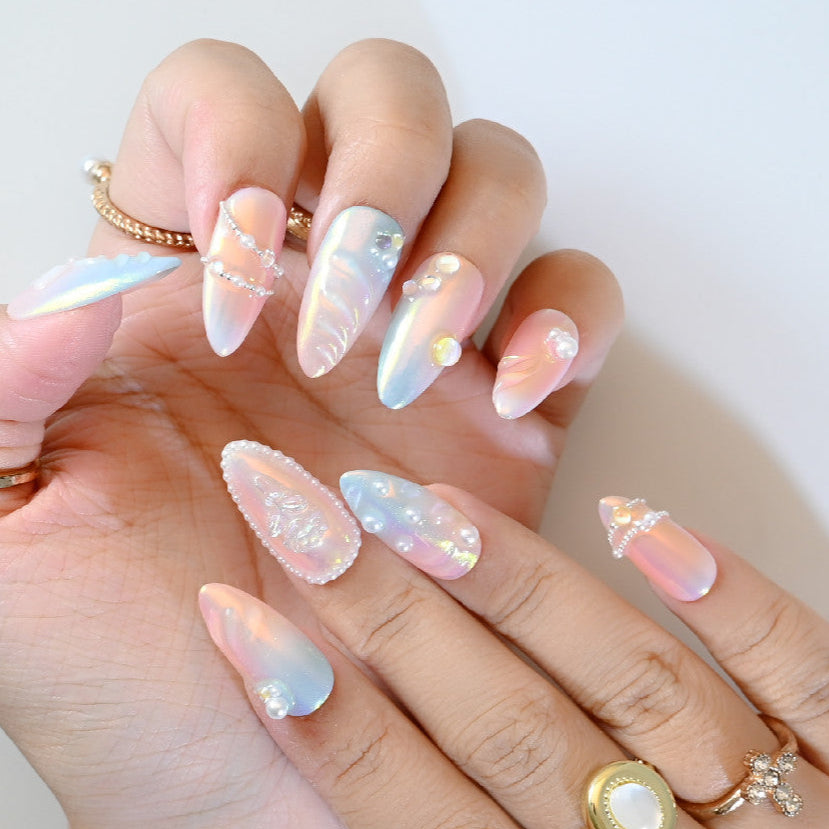 Elegant pearl and gemstone press-on nails with iridescent gradient and floral textures