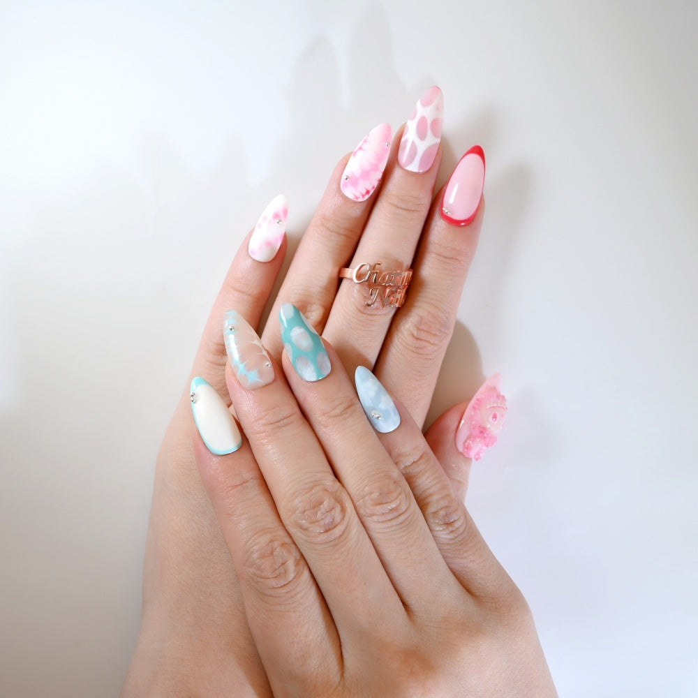 Adorable bunny-inspired nails with pastel tones and silver rhinestone accents