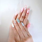 Adorable bunny-inspired nails with pastel tones and silver rhinestone accents