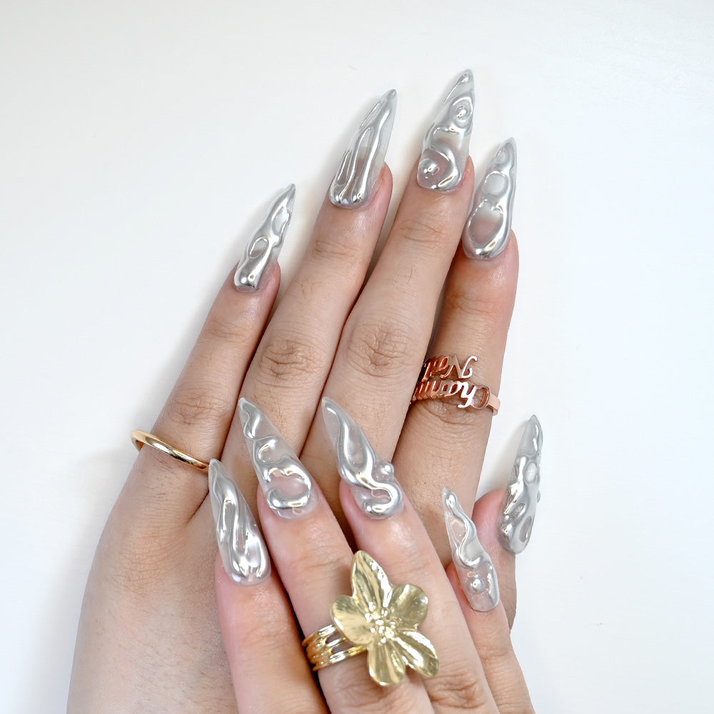 Luxury silver nails with sculpted 3D liquid metal patterns