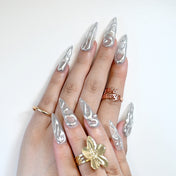 Luxury silver nails with sculpted 3D liquid metal patterns