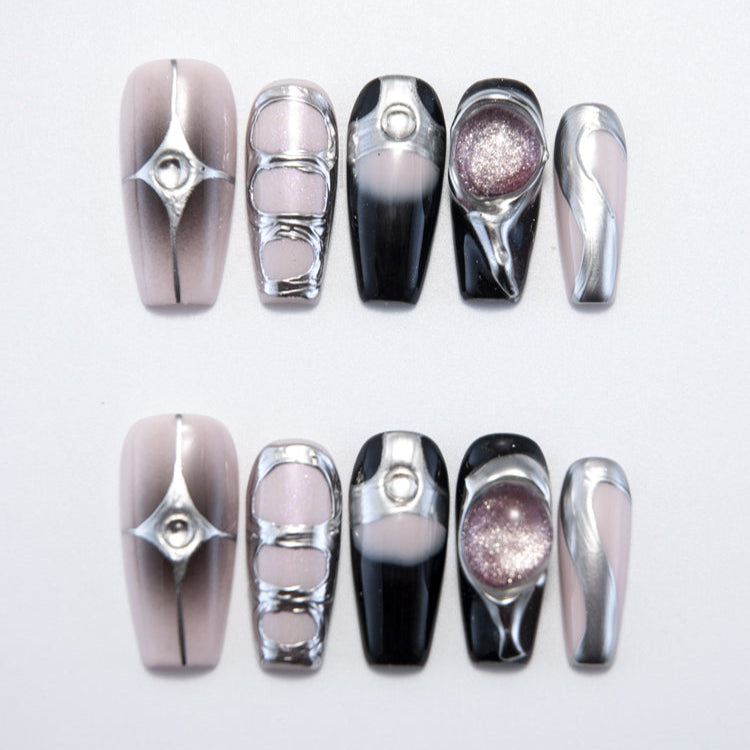 Handmade metallic nails in nude, black, and silver with futuristic geometric designs