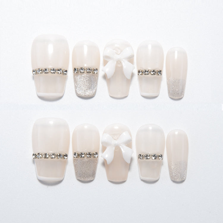 Short square cream handmade press-on nails with silver glitter tips and crystal embellishments