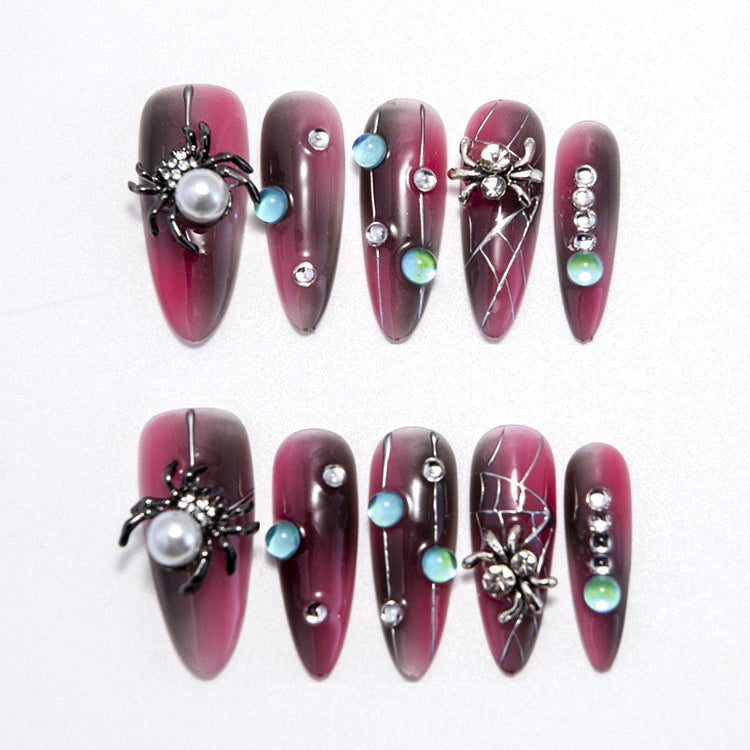 Halloween press-on nails with 3D spider, pearl, and gemstone accents