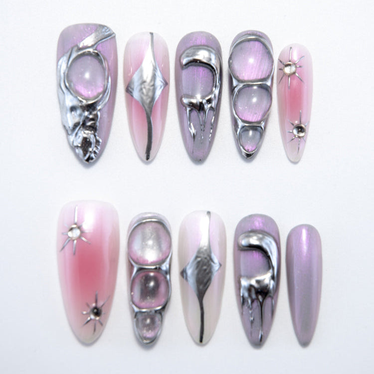 Futuristic press-on nails with metallic silver 3D chrome accents on pink purple base