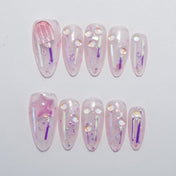Cute pink jelly press-on nails with glitter and 3D popsicle charm