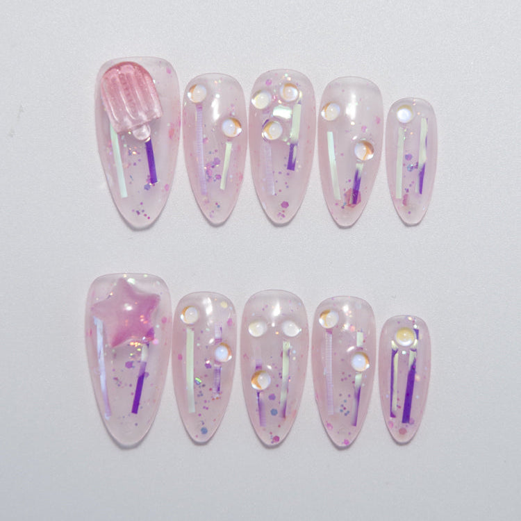 Cute pink jelly press-on nails with glitter and 3D popsicle charm