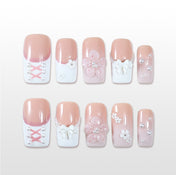 Square press-on nails with 3D bow, pearls, and blush pink base