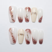 White and brown gradient press-on nails with gold foil accents