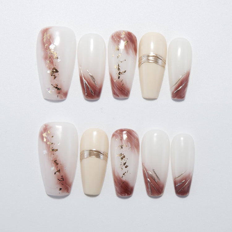 White and brown gradient press-on nails with gold foil accents