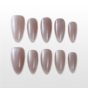 Handmade nude glossy press on nails in almond shape, minimalist design