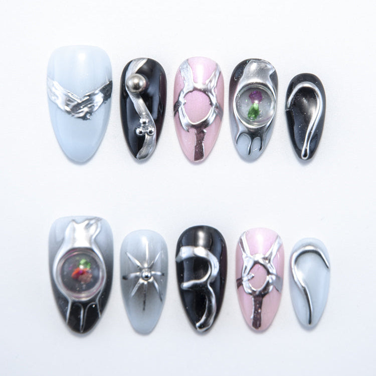 Handmade press-on nails with silver 3D metallic design and gemstone details