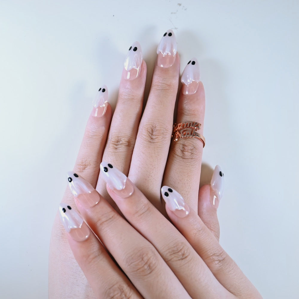 Salon quality nude base press on nails featuring 3D pearl ghost with black eyes