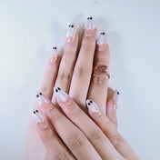 Salon quality nude base press on nails featuring 3D pearl ghost with black eyes